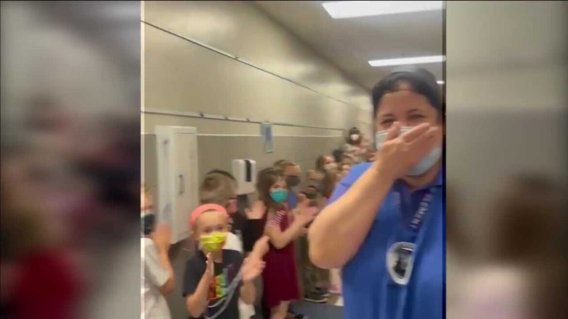 Students cheer on Deer Creek Public Schools employee after she passes